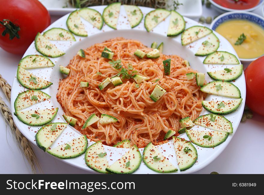 Japanese somen noodles with tomato sauce and zucchinis