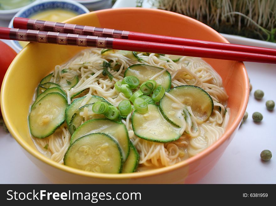 Some asian noodles with zucchini and onions. Some asian noodles with zucchini and onions