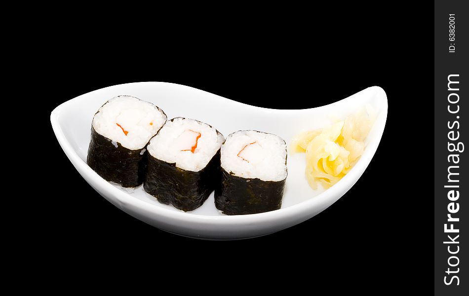 A white plate with a piece of sushi