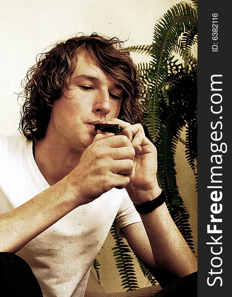 Retro Stylized Photo Of A Boy Smoking Cigar