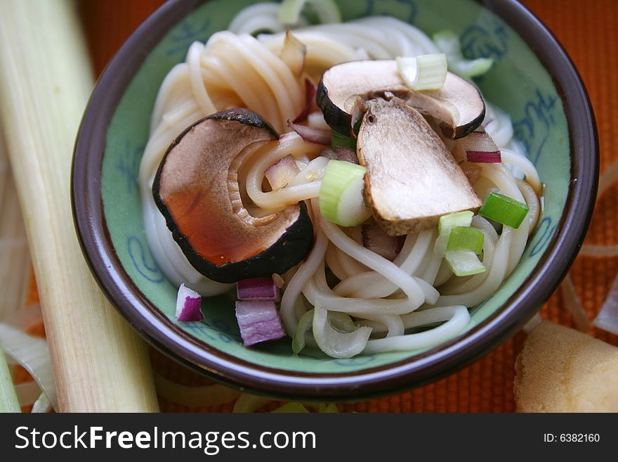 Japanese meal of udon noodles and  mushrooms. Japanese meal of udon noodles and  mushrooms