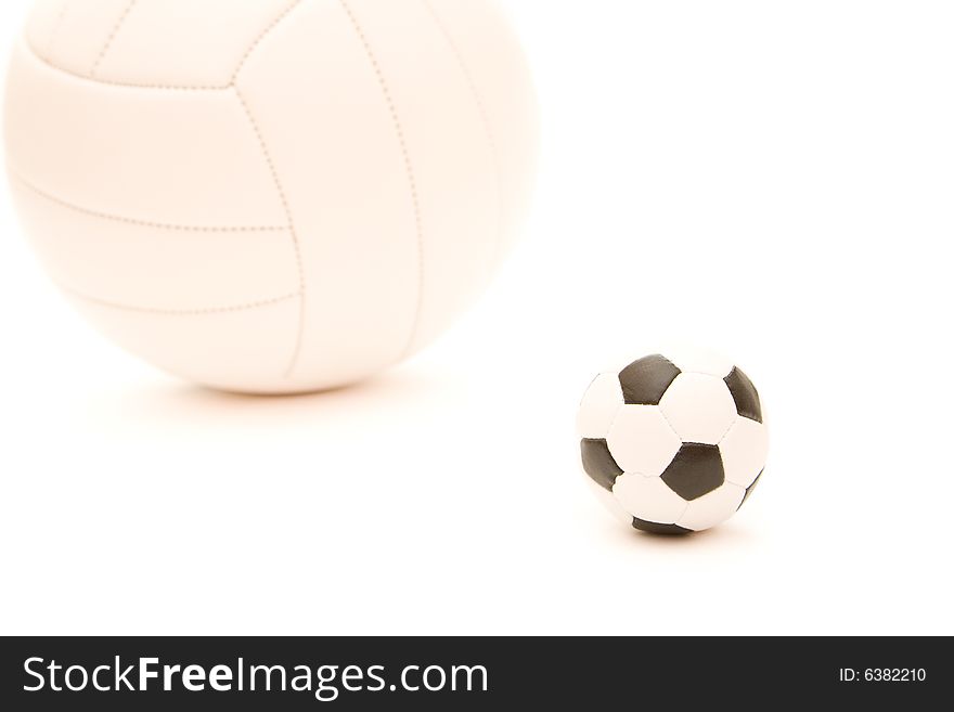 Volley ball and soccer ball different size on white. Volley ball and soccer ball different size on white