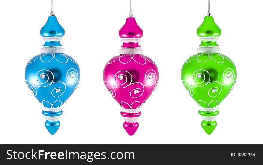 Three christmas ornaments - seasonal decoration - isolated - close up. Three christmas ornaments - seasonal decoration - isolated - close up