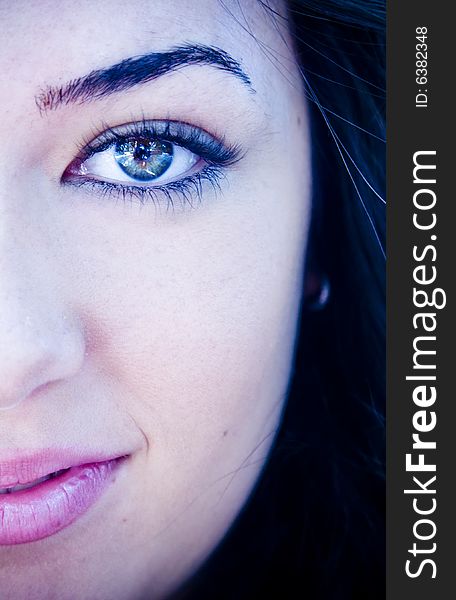 Half full woman portrait with amazing green eyes. Ice toned. Half full woman portrait with amazing green eyes. Ice toned.