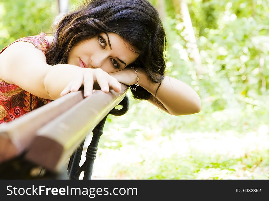 Young beautiful woman posing in the park. Young beautiful woman posing in the park