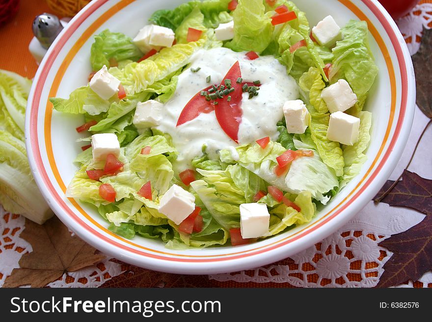 A fresh salad with romana tomatoes and cheese. A fresh salad with romana tomatoes and cheese