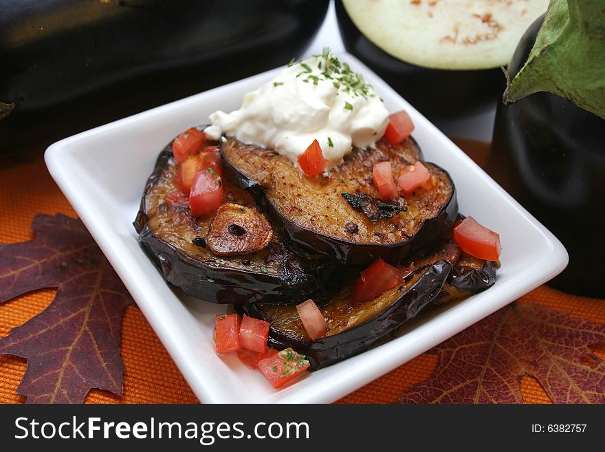 Fresh aubergines with tomatoes and cream