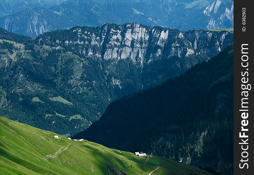 Zweienchopf ridge in Switzerland, in Bergmassiv. The highest point is 1856 m altitudine.  Down you can see Tamina valley and in front is Valplona valley and Obersass chalet. Zweienchopf ridge in Switzerland, in Bergmassiv. The highest point is 1856 m altitudine.  Down you can see Tamina valley and in front is Valplona valley and Obersass chalet.