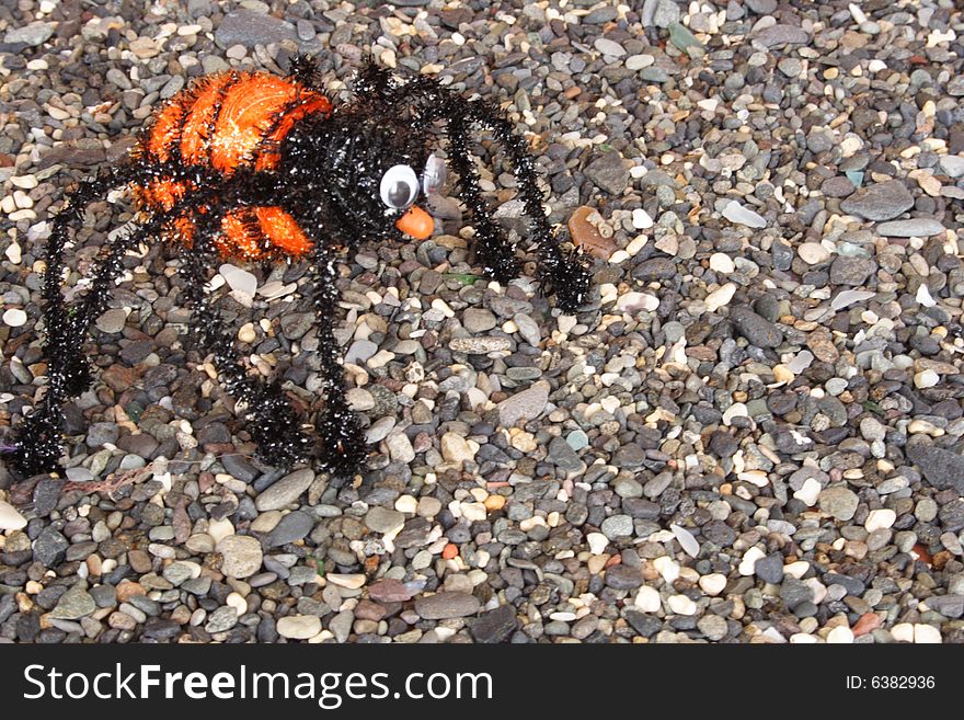 Orange tarantula on the floor in Halloween time. Orange tarantula on the floor in Halloween time