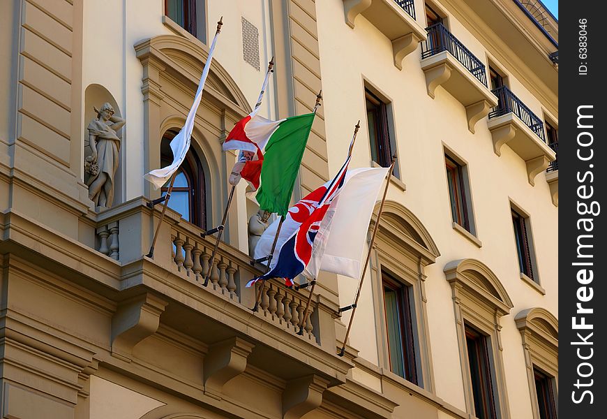 A good shot of some flags waving at a balcony. A good shot of some flags waving at a balcony