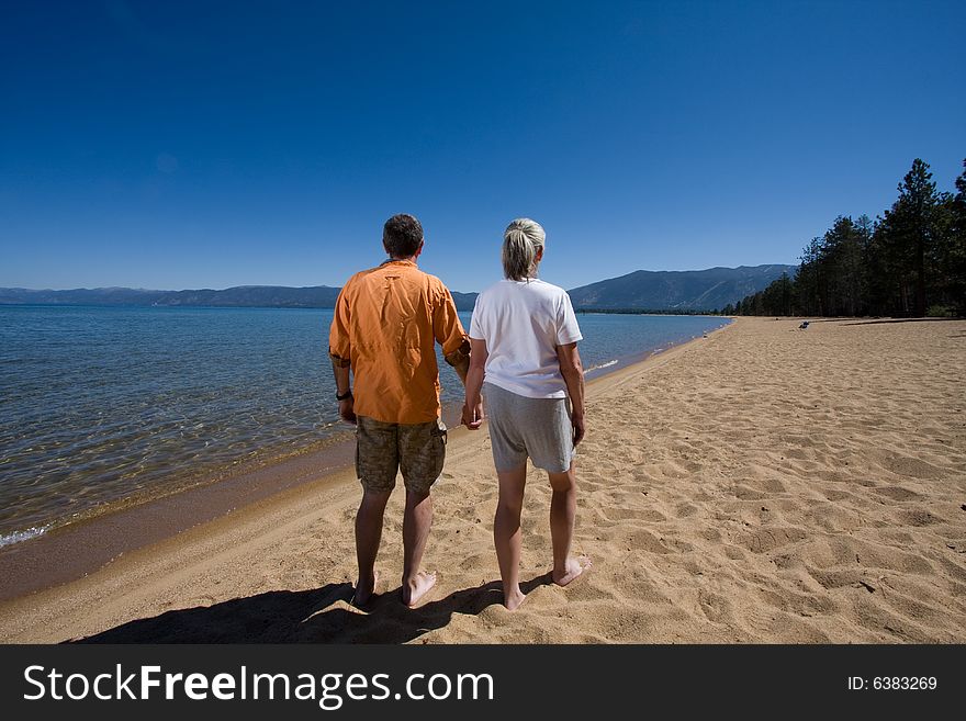 Senior couple having fun on sunny beach. Senior couple having fun on sunny beach