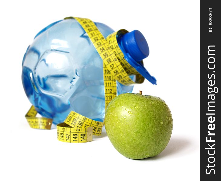 Plastic bottle of water and green apple. Plastic bottle of water and green apple