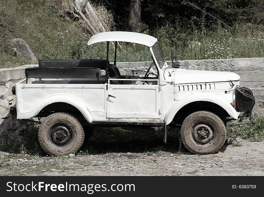 Old four wheels drive car, abandoned, unknown model. Old four wheels drive car, abandoned, unknown model