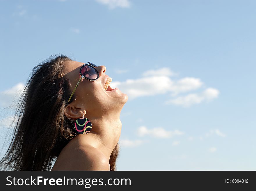 Portrait of the young beautiful girl on a background of sky. Portrait of the young beautiful girl on a background of sky