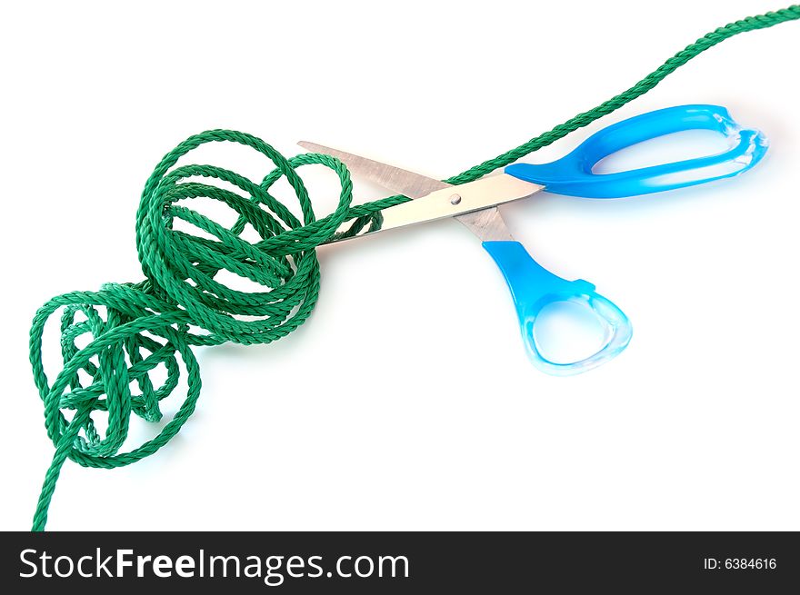 Green synthetic cord and steel scissors on overwhite background. Green synthetic cord and steel scissors on overwhite background.