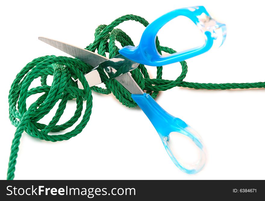 Green synthetic cord and steel scissors on overwhite background. Green synthetic cord and steel scissors on overwhite background.
