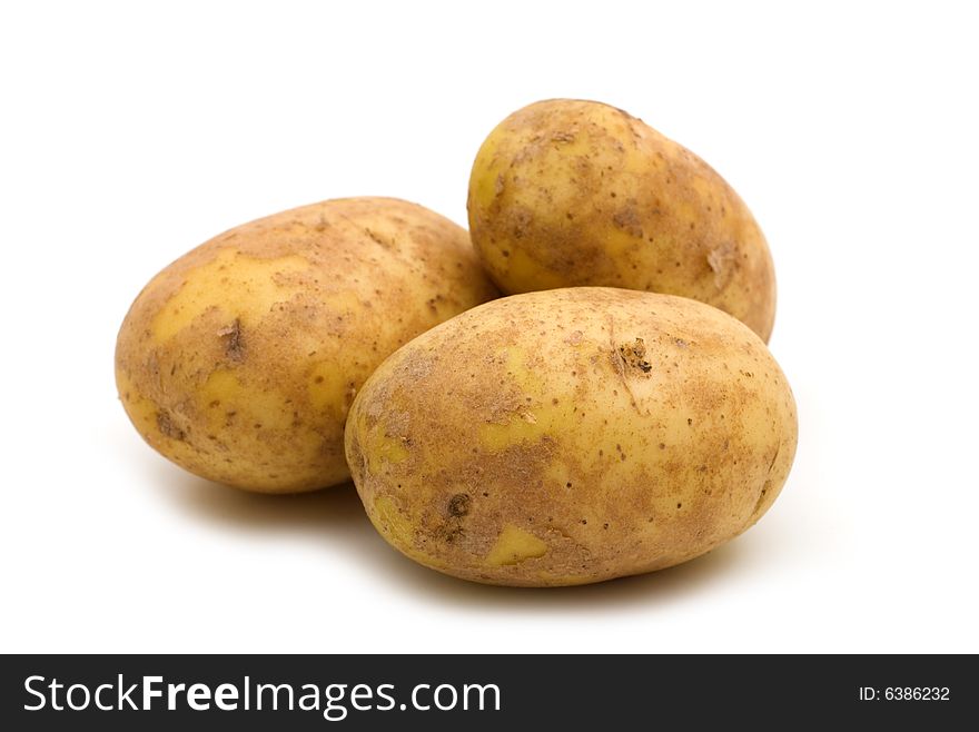 Raw potatoes on white background