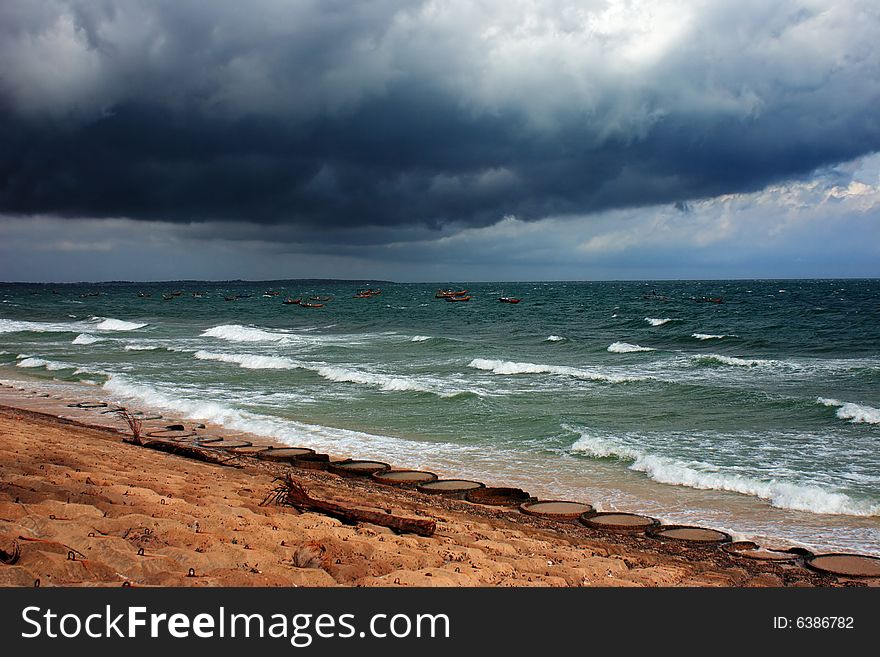 Dark clouds over storming South China Sea, Vietnam, Mui Ne. Dark clouds over storming South China Sea, Vietnam, Mui Ne