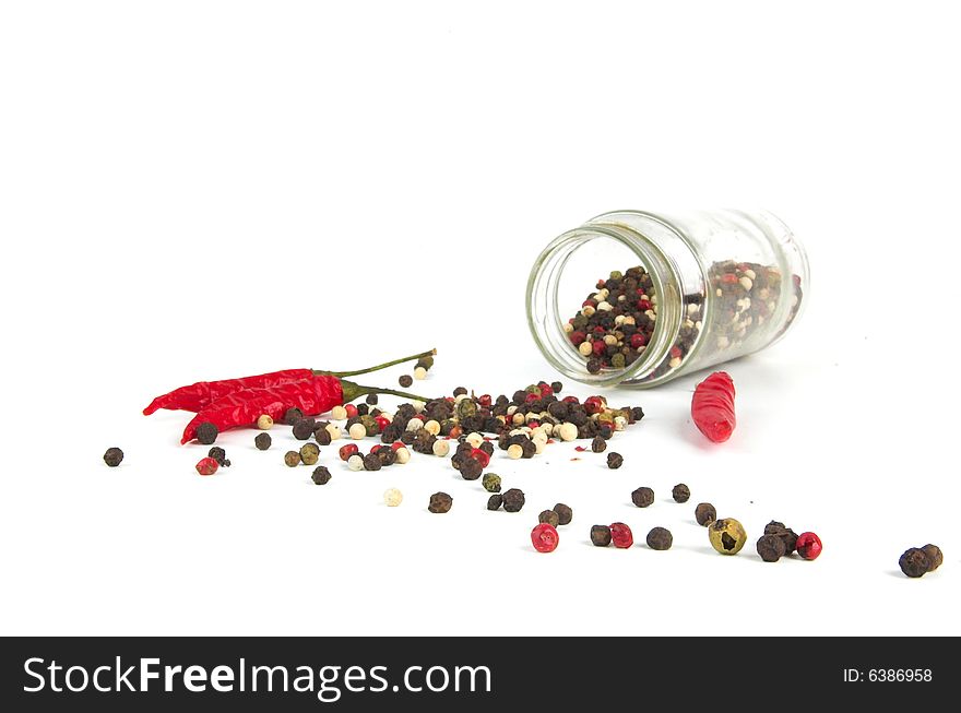 A row of spices on a white background