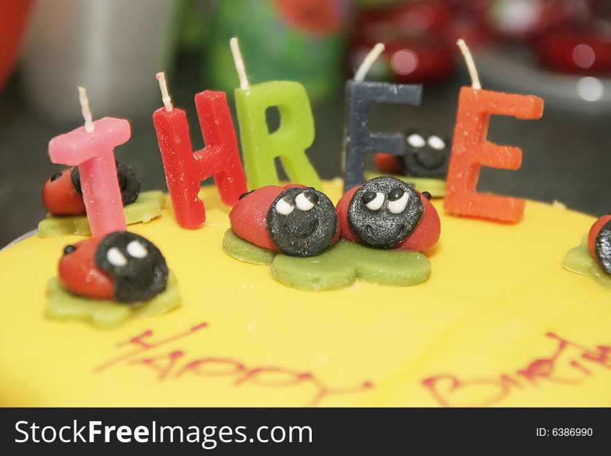 Close up of a childs 3rd birthday cake