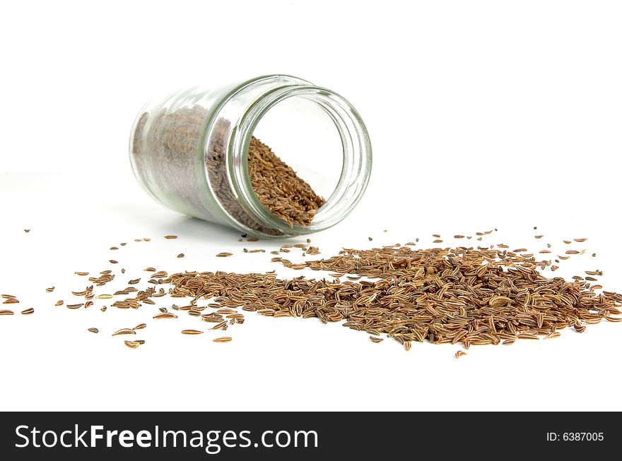 A row of spices on a white background