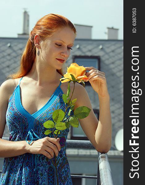 Young girls with a yellow rose and blue dress