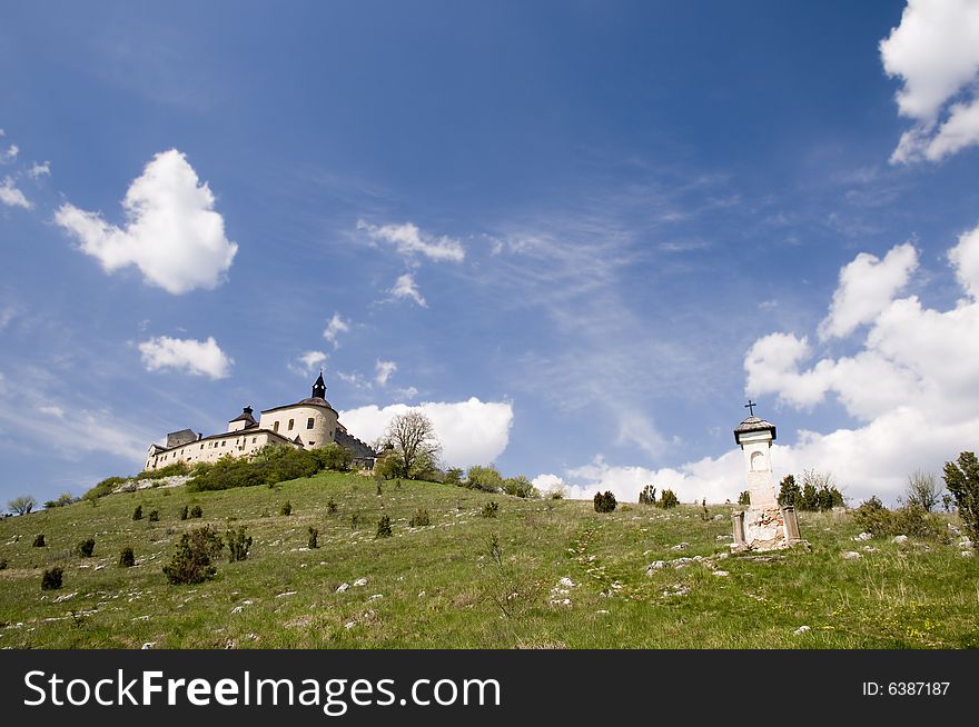 Castle of Krasna Horka with blue sky and clouds. Castle of Krasna Horka with blue sky and clouds