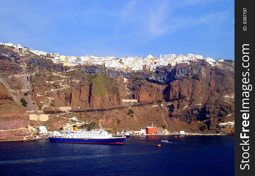 A wonderful shot of the old port of Santorini with ships and Ftira village. A wonderful shot of the old port of Santorini with ships and Ftira village