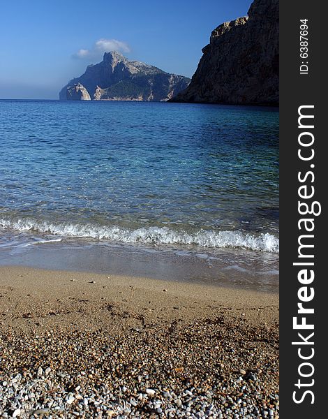 Beach in a bay between mountains in a North of the island of Majorca in Spain