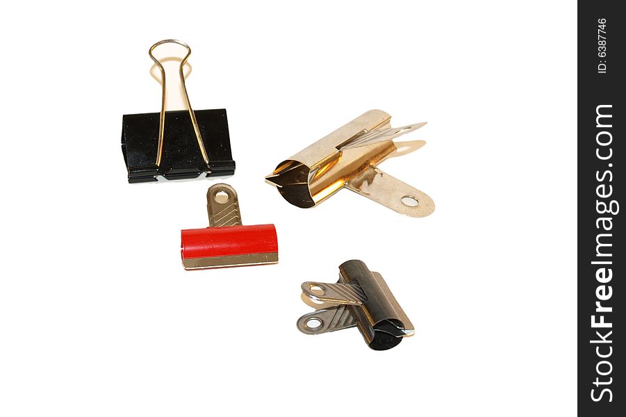 Selection of document clips and clamps,  bull dog type, isolated on white background. Selection of document clips and clamps,  bull dog type, isolated on white background.