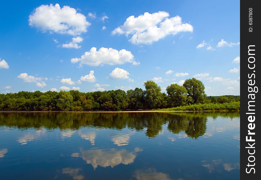 River, forest and sky sunny day