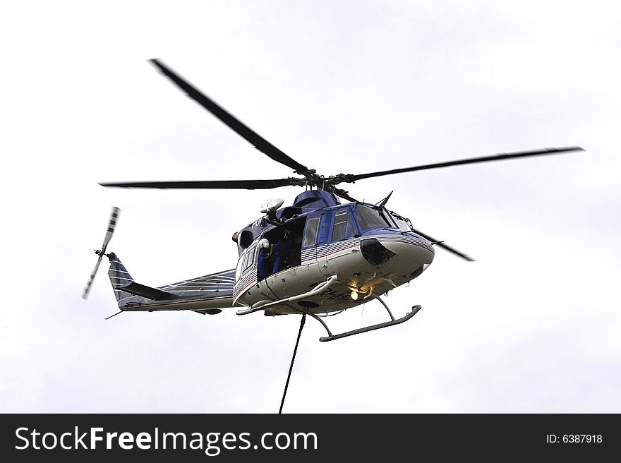 Detail of police descend from a helicopter. Detail of police descend from a helicopter