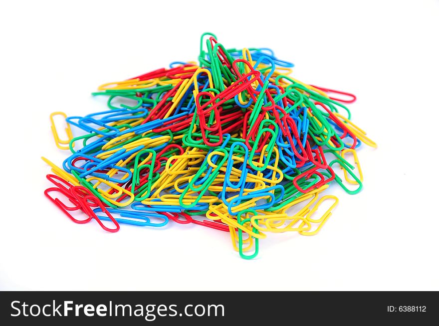 Shot of some colourful paper clips on white