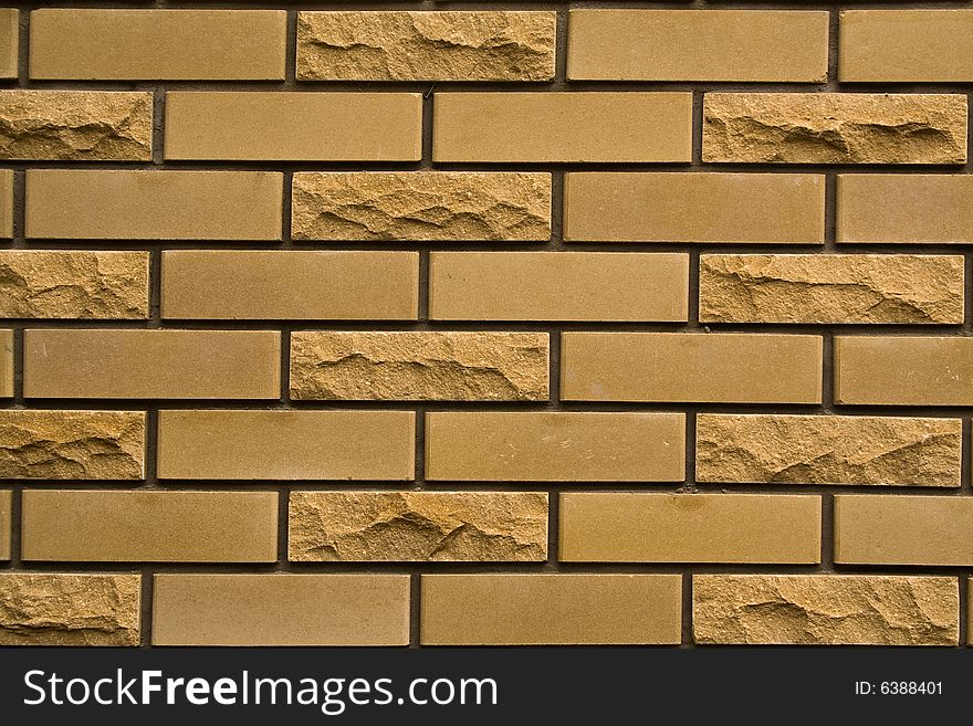 Yellow brick wall of city house