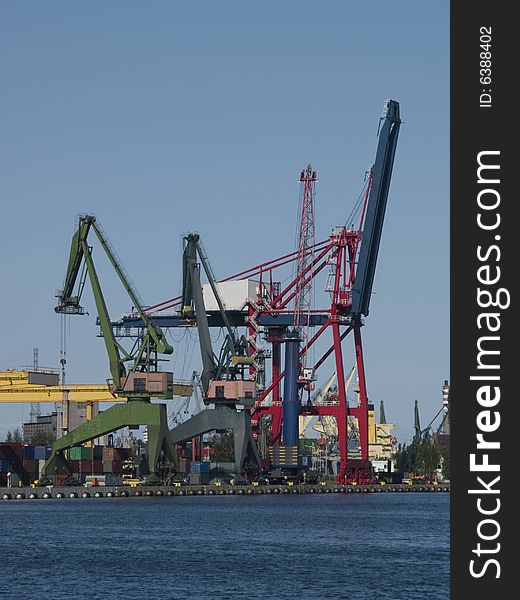 Gantry cranes and containers in a harbor. Gantry cranes and containers in a harbor
