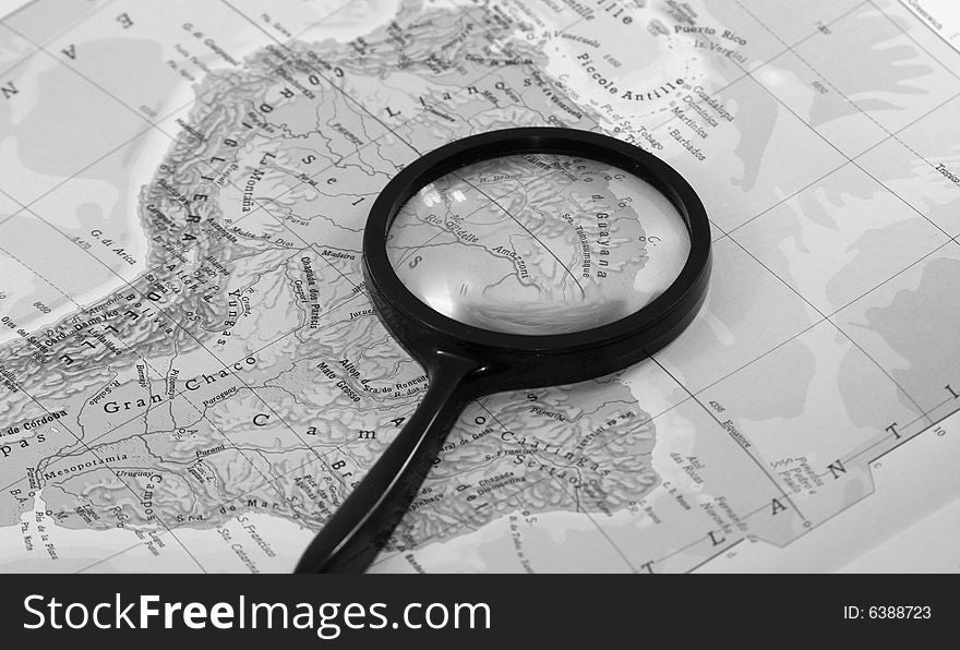 A magnifying glass on Europe map. A magnifying glass on Europe map