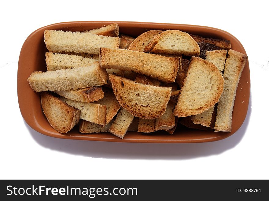 Crackers in brown bowl isolated on white