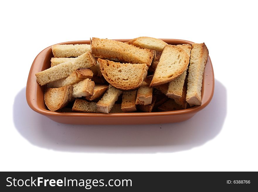 Crackers in brown bowl on wooden table