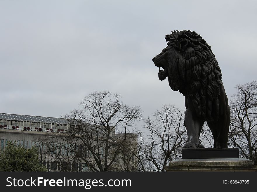 Park in the city centre of Reading, in the Great Britain with the trees and paths for walks. In the middle the monument of lion. Park in the city centre of Reading, in the Great Britain with the trees and paths for walks. In the middle the monument of lion.