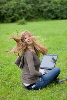 Young Girl Sitting On The Grass. Royalty Free Stock Images Young Girl Sitting On The Grass. Royalty Free Stock Images