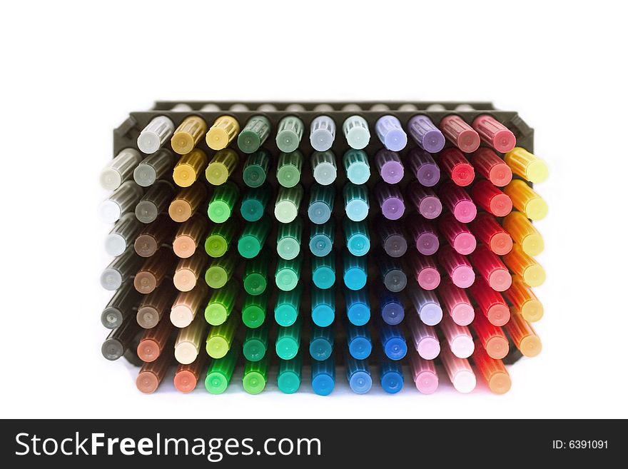 A stack of colorful markers against a white background. A stack of colorful markers against a white background