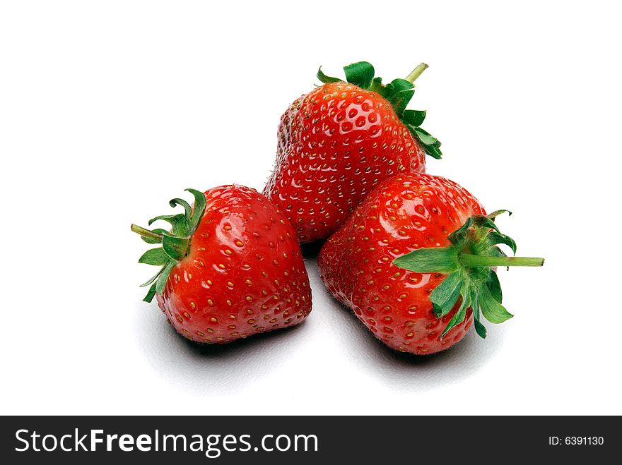 Three Strawberries On A White Background
