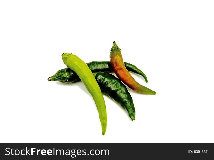 Green and red hot peppers on a white background. Green and red hot peppers on a white background