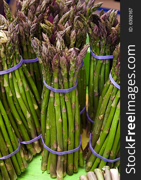 Bunches of asparagus at a local farmers' market. Bunches of asparagus at a local farmers' market.