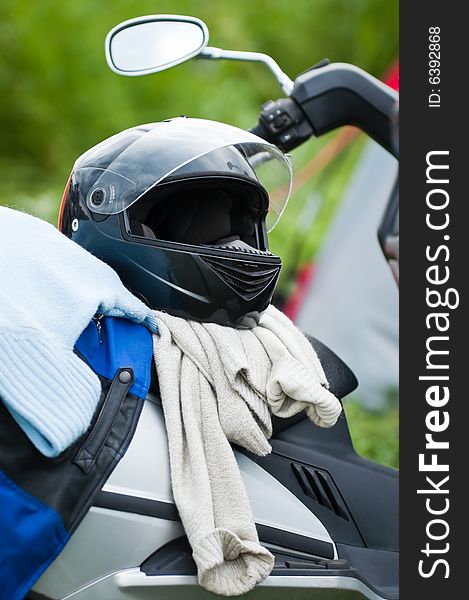 Motobike with helm and jacket on it