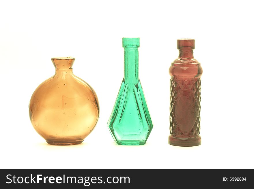 Colorful glass bottles on white background. Colorful glass bottles on white background