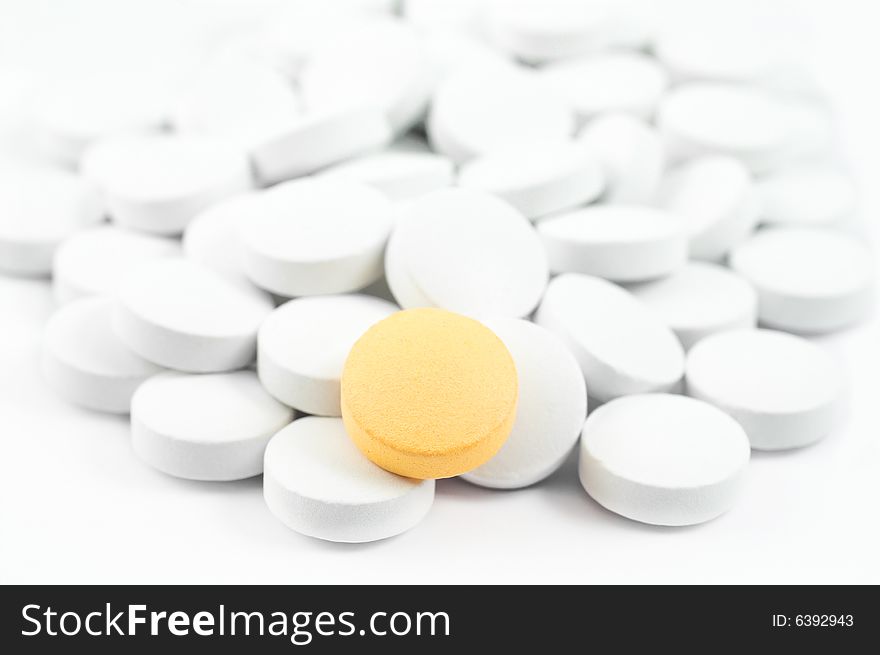 White and yellow pills isolated on white. White and yellow pills isolated on white