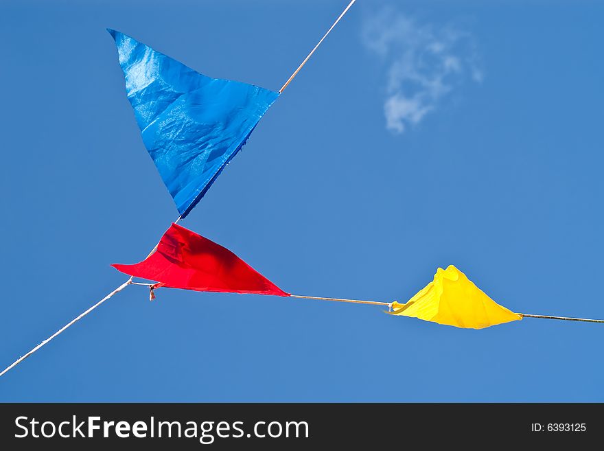 Colourful signal flags hanging on a wire