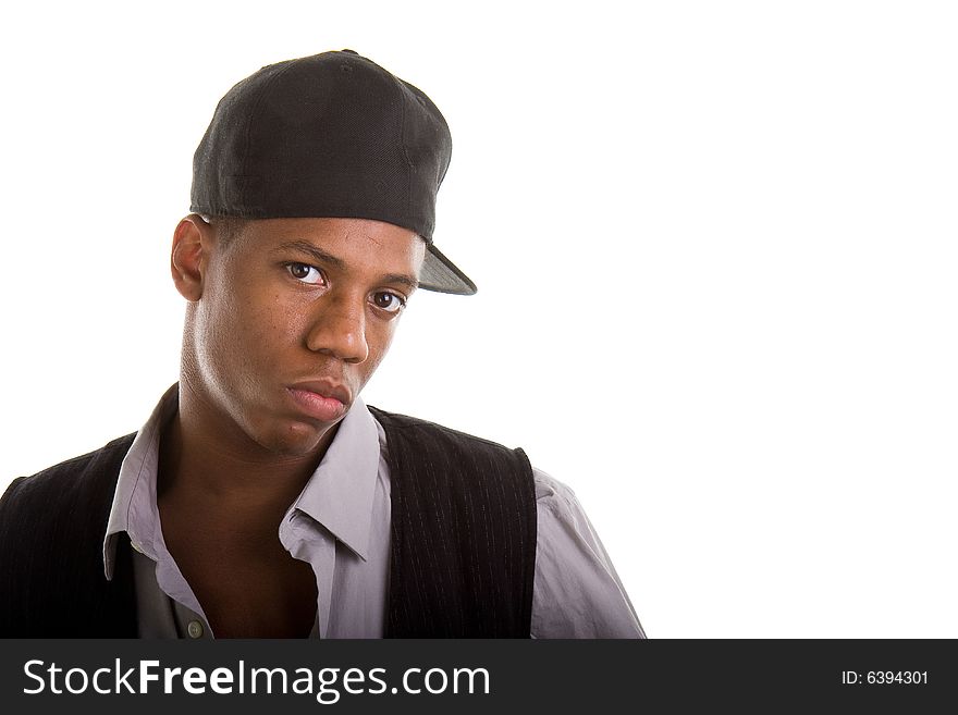 A young black man in grey and black with a black cap on sideways. A young black man in grey and black with a black cap on sideways