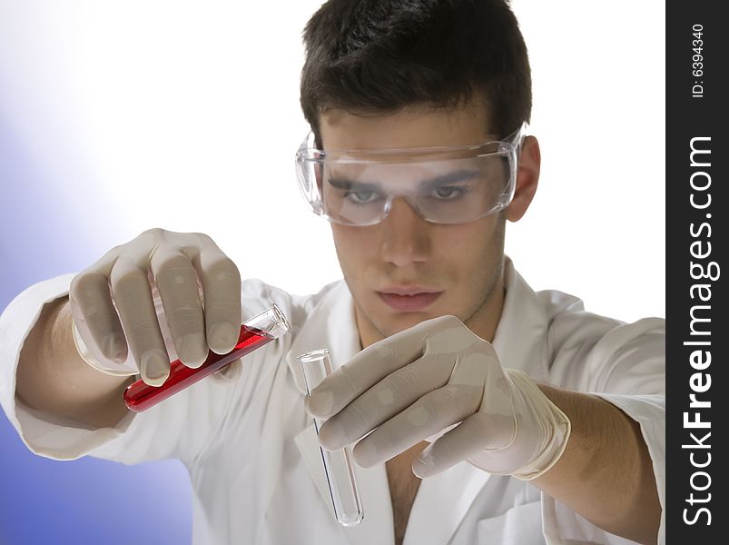 Young scientist working with mask